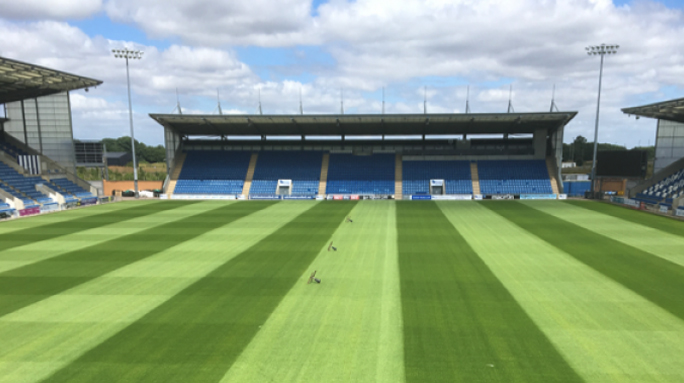 The pitch at Colchester Football Club showing well maintained turf